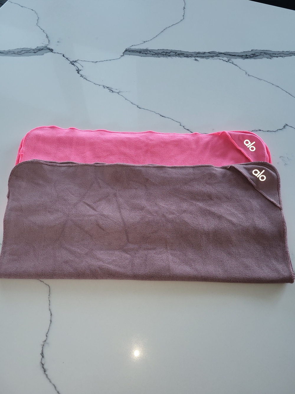 Two ALO Performance Hand Towels